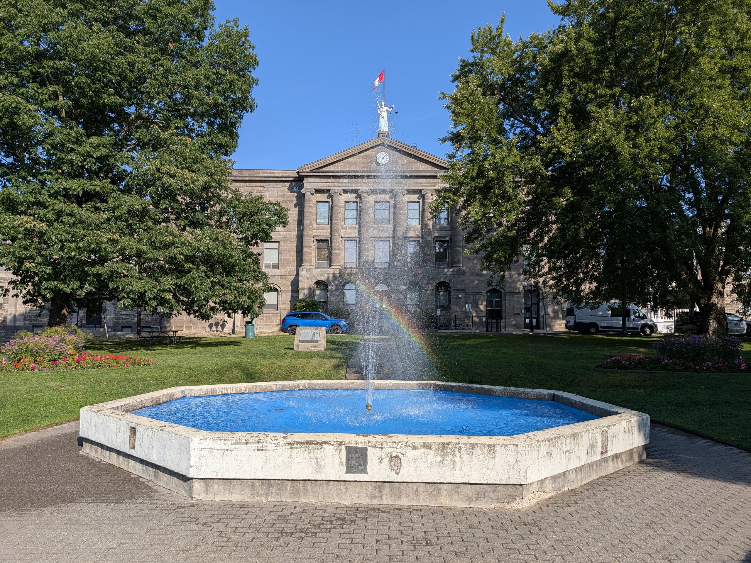 Brockville Courthouse at 41 Court House Square with fountain and rainbow in the foreground, Brockville, Ontario