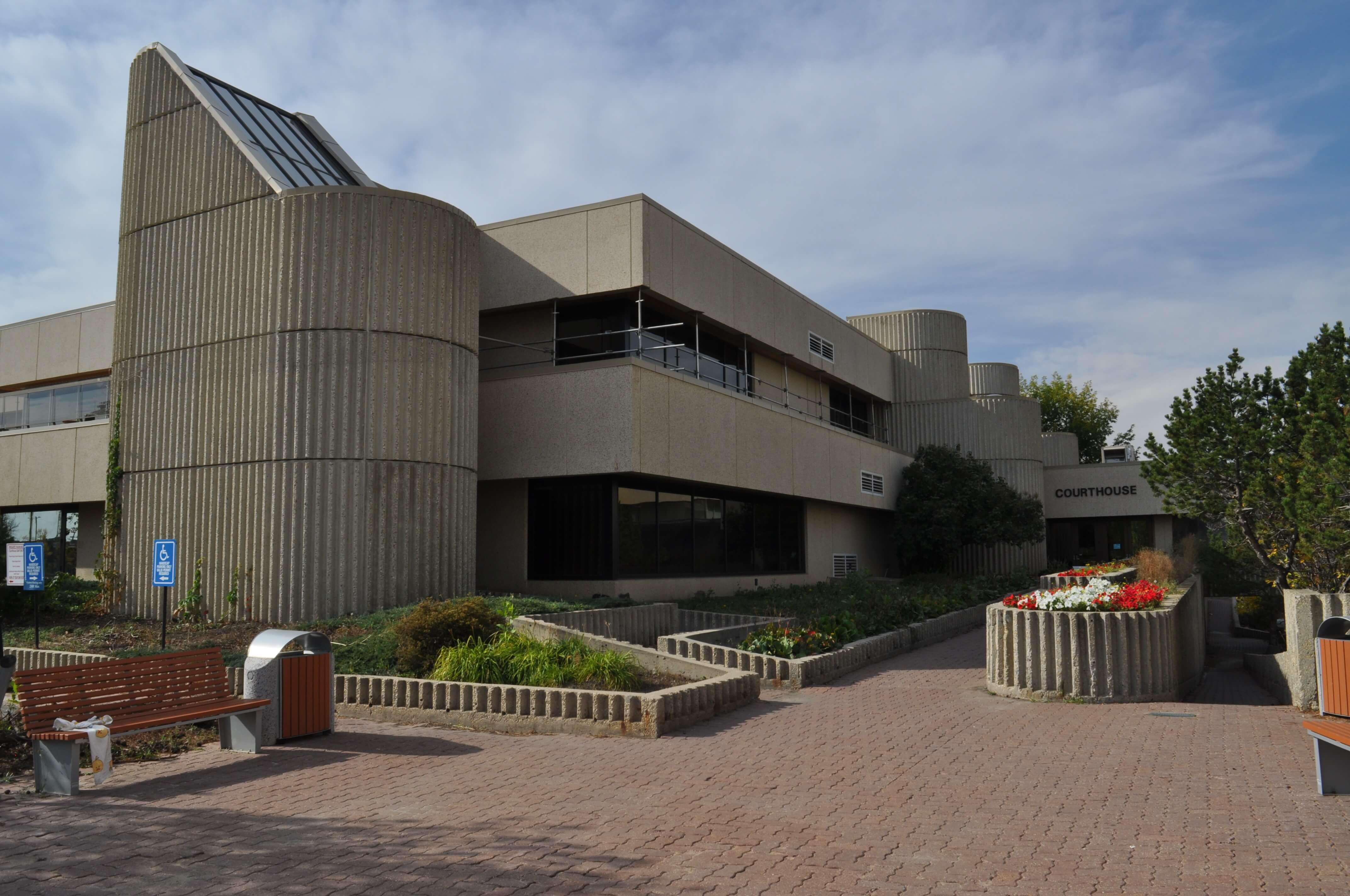 Grande Prairie Courthouse entrance with brick walkway and flower gardens, Grande Prairie, Alberta